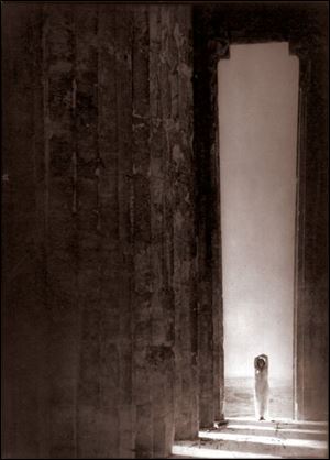 A photograph of Isadora Duncan dancing in the Parthenon.