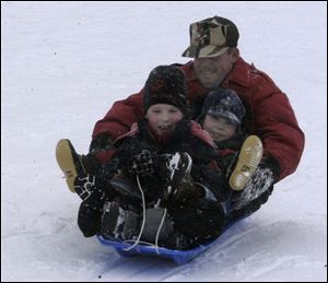 Cty At ottawa park MIchael Day,6, Eric Day 3 Father Steve day of toledo.  blade photo  by herral long 1/17/2004