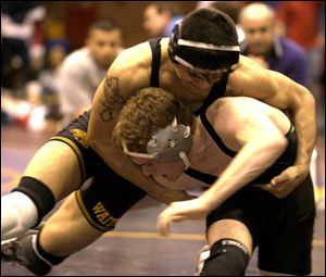 Waite's Antonio Ramirez gets the upper hand against Delta's Ryan Gombash at 130 pounds.