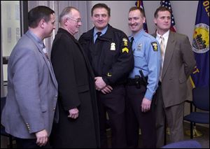 The Bombrys family includes, from left, Capt. Wes; Ed, Sr.; Sgt. Mike; Sgt. Matthew, and Lt. Ed, Jr. Ed, Sr., a Toledo Police Department retiree, is the father of the other four, who serve on the force now.