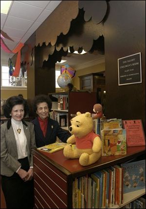 Nbr Georgianna and  Dorothy Saloff in the childrens area  (room) at Birminghan library  they donated - note plaque on wall. Blade photo by herral long  1/26/2004
