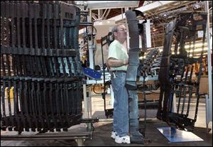 Ron Benzler is among the 470 employees still at the Adrian plant of the parts maker spun off by GM in 1999.