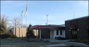 Holland will buy back the building at left because of a growing need for more space.