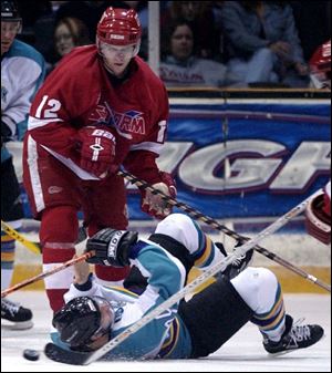 Atlantic City's Paul Falco loses the puck after being flattened by Toledo's Danny Eberly during the first period. The Storm avoided tying for the most losses at home in ECHL history.