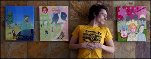 Max Lawrence with some of his figurative paintings at Space 237 downtown.
