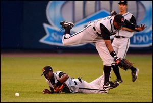 Joe Vitiello's bloop eluded Buffalo's Brandon Phillips (on ground), Eric Crozier (jumping) and Grady Sizemore.