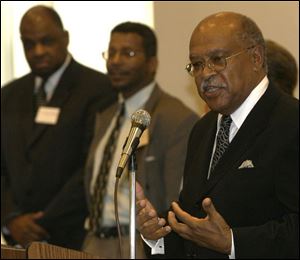Virgis Colbert addresses the 1954 U.S. Supreme Court 'Brown vs. Board of Education' decision with Toledo Public Schools Superintendent Eugene Sanders, left, and Dr. Carter Wilson.