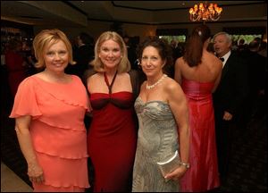 A FLING FOR SPRING: From left, Jane Mullkoff, Kay Lyon, and Leslie Ford glam it up while dressed in their seasonal best at Stone Oak Country Club.