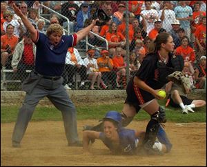 Amanda Ronk slides home in the fourth inning for Crestline s first run as Gibsonburg s Julie Beaschler gets the ball too late.