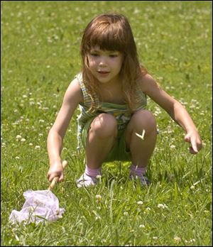 rov butterfly15p 2 June 15, 2004. Jordan Karl-Defrain, 5, of Maumee chases butterflies at SideCut Park Tuesday afternoon. Blade photo by Jeremy Wadsworth