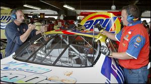 Steve Williams, left, and son Chris wouldn't want to be any other place than MIS today for the DHL 400.