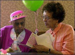 Emma Parks marks her 105th birthday with her daughter-in-law, Nettie Parr.