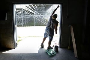 ROV regionpaint 01 - Dean Taft does some routine mainatinance at the Bowling Green fairgrounds in preparation for the upcoming Wood County Fair which starts August 2. Allan Detrich/The Blade