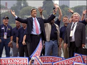 John Kerry arrives at the Charlestown Navy Yard in Boston, joined by fellow Vietnam veterans and crewmates, a day before he is to accept the Democratic nomination for president.