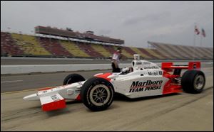 Sam Hornish Jr. peels out of the pits during a practice session at Michigan International Speedway on Friday.