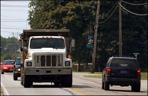 Thanks to rail congestion, motorists in Oregon must share the streets with a growing number of coal-hauling trucks.