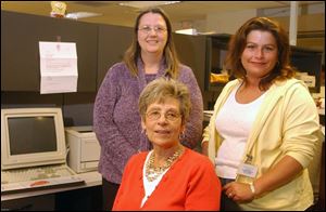 Monroe County clerk Geri Allen, seated, with deputy clerks nancy Chalupka, standing at left, and Laura Senters, who both thought election night vote counting was going to be easy.