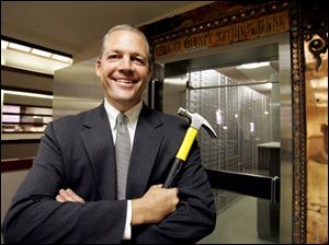 The Bank of Lenawee has a small town feel, but its president, Richard DeVries, uses a yellow hammer to spread his message of crushing the competition.