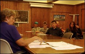 Teenagers from Findlay's Youth Task Force discuss issues that concern them with Jeanne Rustic, the community solutions director at United Way of Hancock County.