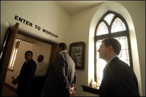 District 4 congressional candidate Ben Konop follows Toledo Mayor Jack Ford into the sanctuary at Second Baptist Church in Lima yesterday where he sought votes for November's election.