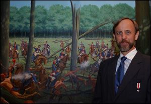 Alabama artist Dean Mosher with his painting 