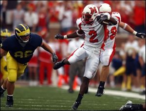 Central Catholic graduate Ryne Robinson piled up 249 yards in punt and kickoff returns yesterday for Miami. He had a 59-yard punt return for a touchdown nullified by a penalty.