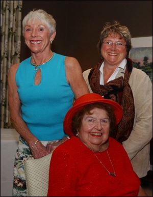 Ninety-year-old June Patterson, seated, celebrates with daughters Susie Cavalear, left, and Sally McCarthy at Belmont.