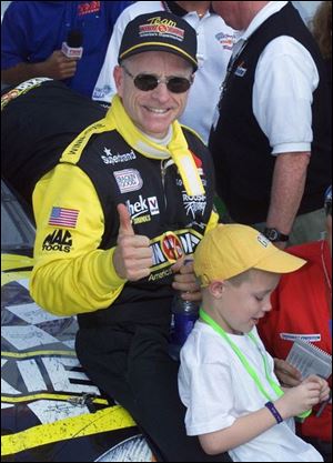 Mark Martin celebrates a win in February at Rockingham with son, Matt, 8.