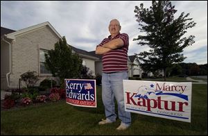 Sylvester Wcislak refuses to remove political signs from his villa, despite a warning from the property manager to do so.