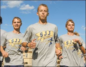 Freshman Joe Miller, center, and sophomore Chris Lemon, left, and Matt Lemon.