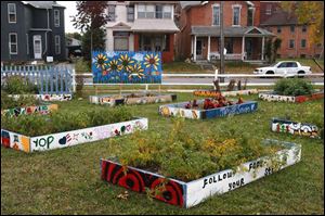 A garden area spruces up surroundings at Crittenden and Broadway.