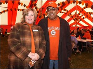 WELCOME HOME: Denise Olson, Class of '88, and Andre Craig, Class of '79, party with other BGSU grads.