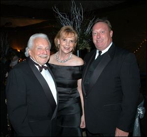 IN TUNE: From left, Bernie Leiter, Barbara Steele, and Alan Kimpel enjoy a moment of harmony.
