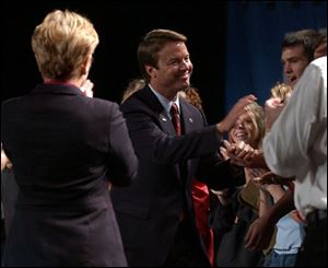 Some of the 2,500 supporters greet John Edwards at the SeaGate Convention Centre downtown. The vice presidential candidate focused on Iraq war concerns and Social Security.