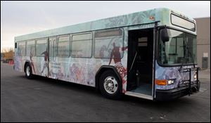 Four colorful TARTA buses wrapped from top to bottom with designs and poetry by area students are on the road, to be joined by another two next week.
