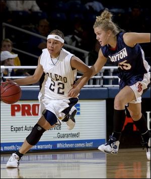 Toledo guard Crystal Young beats Dayton's Ashley Armstrong down the court. Young led UT with 13 points and five assists.