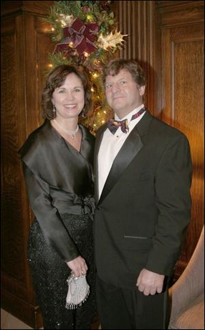 READY FOR 2005: Sharmon and John Minns look ahead to the new year together during the celebrations at the Toledo Club.