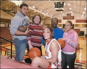 Sara and Mel Minnfield have watched their children excel, including Corey, left; Jessica (front), and Melissa.