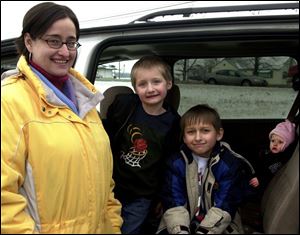 Terra Meeker, a resident of Wauseon, views the smoking ban in her city as protection of the health of her young family: Jadon, 4, from left, Cale, 7, and Aslinn, 1.