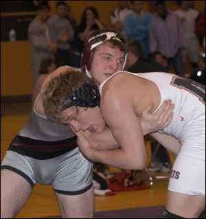 Genoa's Nick Purdue, left, goes against Mount Vernon's Travis Popham in the 160-pound final. Popham won 6-4.