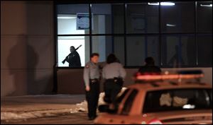 Toledo police officers converge on the Toledo Jeep Assembly Plant on the city's north side after the shooting.