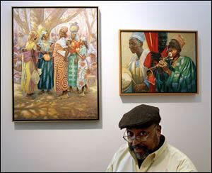 Artist Wil Clay with two of his paintings, Cameroon Market,
left, and Cameroon Music, at the 20 North Gallery.

