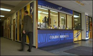 Outside the University of Toledo's Savage Hall ticket office are new graphic panels, some displaying former and current Rocket athletes.