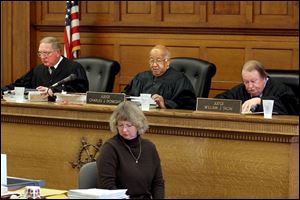 The three-judge panel of, from left, Ronald Bowman, Charles Doneghy, and William Skow will hear closing arguments tomorrow during the sentencing phase of the trial of Eric Harmon. Yesterday's session at Lucas County Common Pleas Court lasted 11 hours and included testimony from Harmon's mother, Diana Roe.