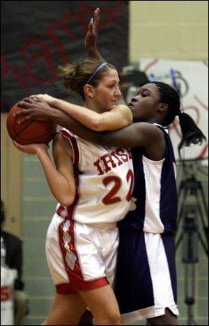 Waite Briana Washington, right, ties up Central's Emily Large as the Indians upset the Irish in a City League semifinal.
