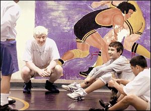 Kevin Roper, who has albinism, feels wrestling helps him fit in at Waite. He tried cross country and baseball without success.