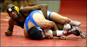 Start's Roshawn Jones looks up as he battles Anthony Wayne's Luis Briceno. Jones won the 112-pound sectional crown.