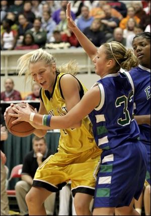 Northview s Lisa Johnson, left, tries to fight her way past
Chaminade-Julienne s Jena Schafer on her way to the basket.
