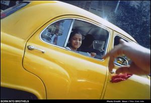 Cab Ride is the title of a photo taken by 13-year-old Gour, one
of eight children befriended by Born into Brothels director
Zana Briski. The film won the Oscar for best documentary.