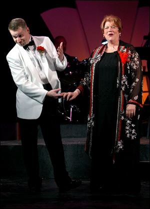 John Hopkins, left, who is also director of the musical revue, rehearses a number with Janna Ravel.